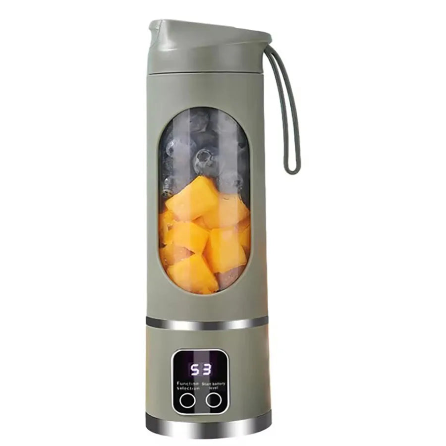 Sage green portable personal blender with a clear center window, digital display, and fruit inside.