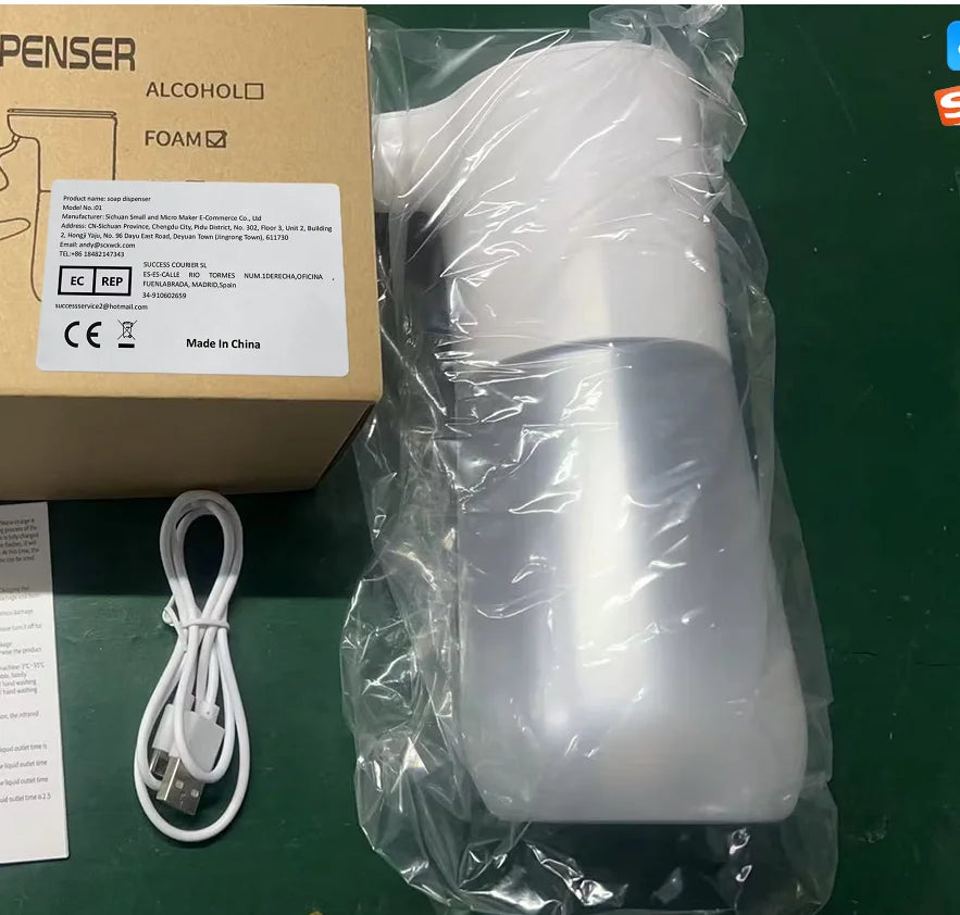 White automatic touchless foam soap dispenser (350ml) in clear packaging, including a USB charging cable and box.