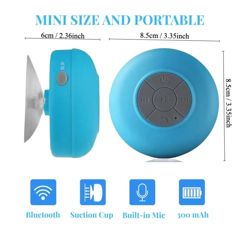 Mini blue waterproof wireless speaker with integrated suction cup, control buttons, and built-in microphone.