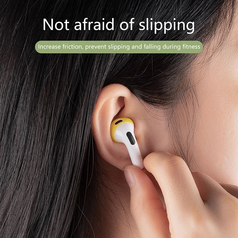 Yellow silicone anti-slip cover for Apple AirPods Pro worn in ear.
