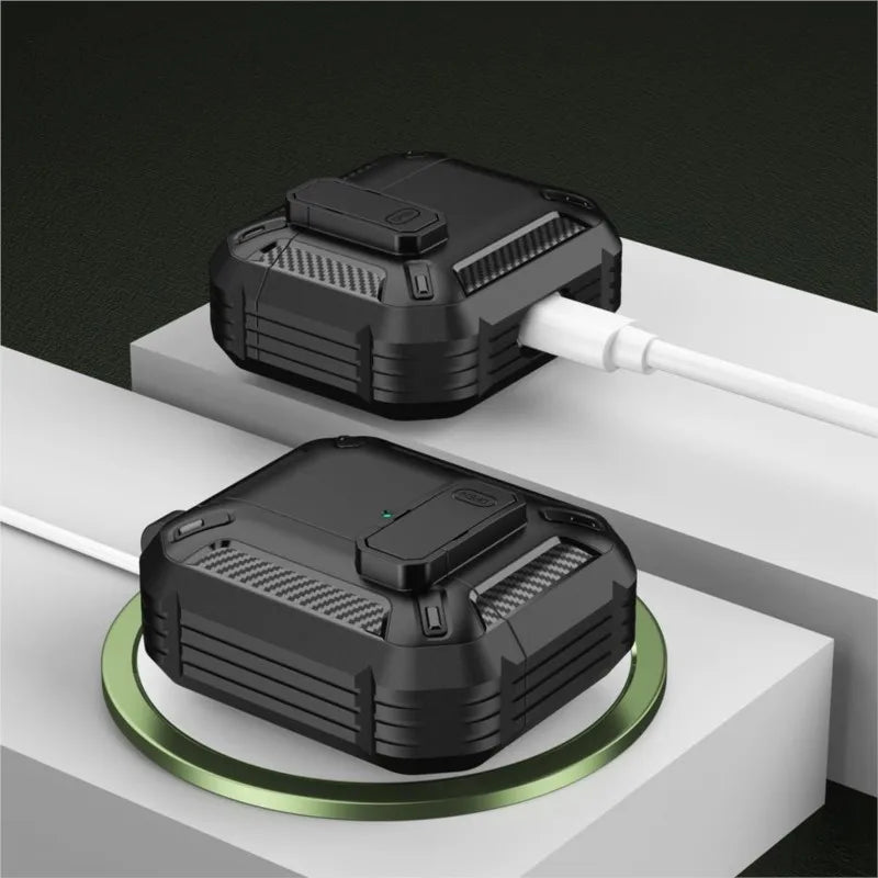 Rugged black carbon-fibre style AirPods protective case with secure latch, shown charging on a wireless pad.