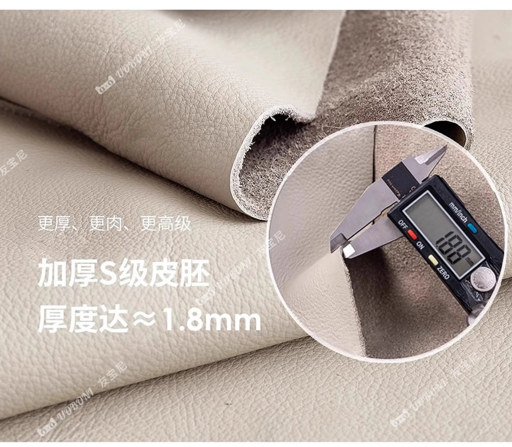 Close-up of premium, light beige genuine leather upholstery for a bed frame, showing its durable 1.8mm thickness.