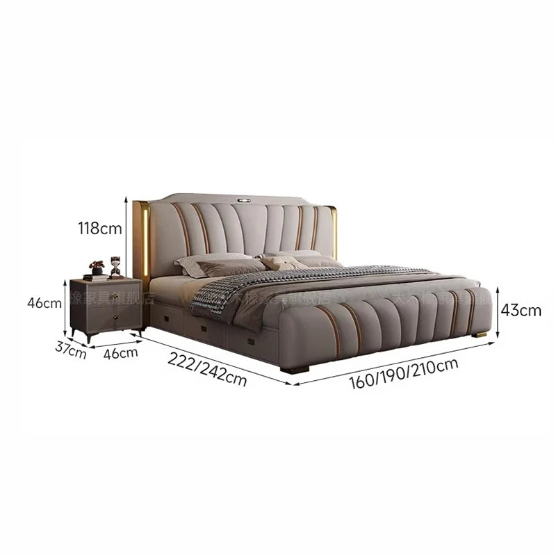 Modern grey upholstered bed with gold accents, integrated headboard lighting and a matching bedside table.