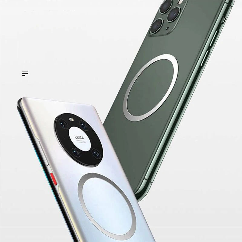 Two smartphones with circular magnetic charging rings on their backs, one silver with a triple camera and one dark green.