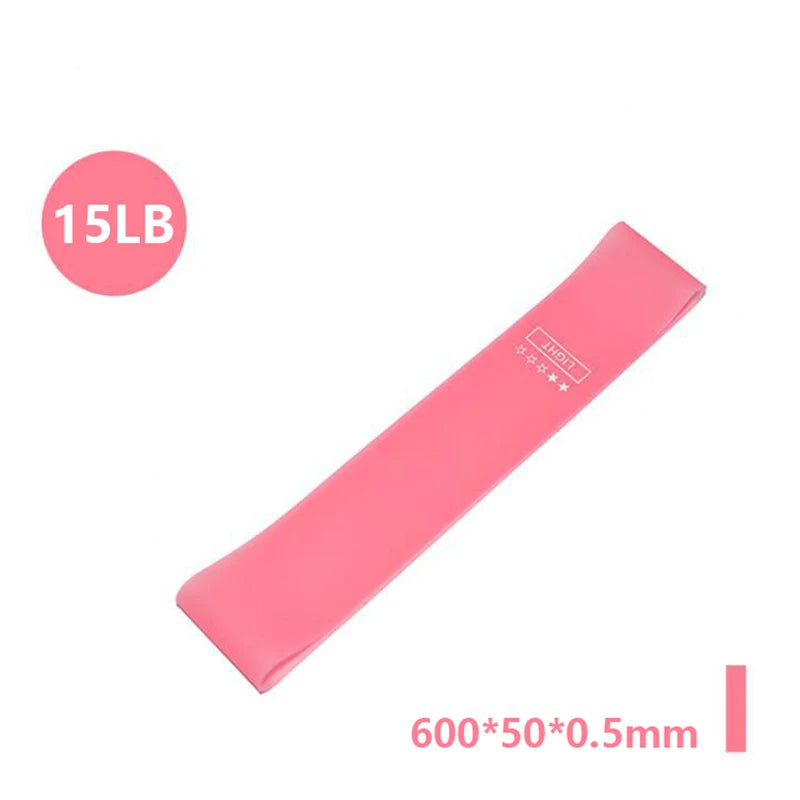 Pink 15lb resistance band with "LIGHT" label and 600x50x0.5mm dimensions shown on a white background.