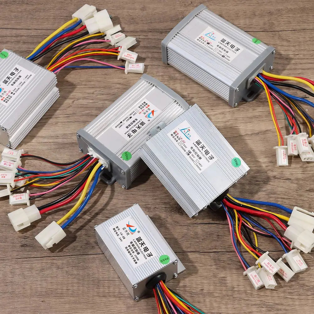 Silver aluminum brushed electric bike motor controllers with colorful wiring harnesses and white connectors.