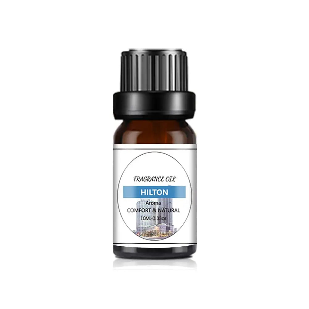 10ml amber glass bottle of fragrance oil with a black cap and a white label featuring blue accents.