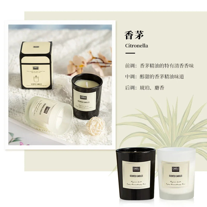 Black and frosted white scented candles in glass jars, featuring elegant labels and matching gift boxes.