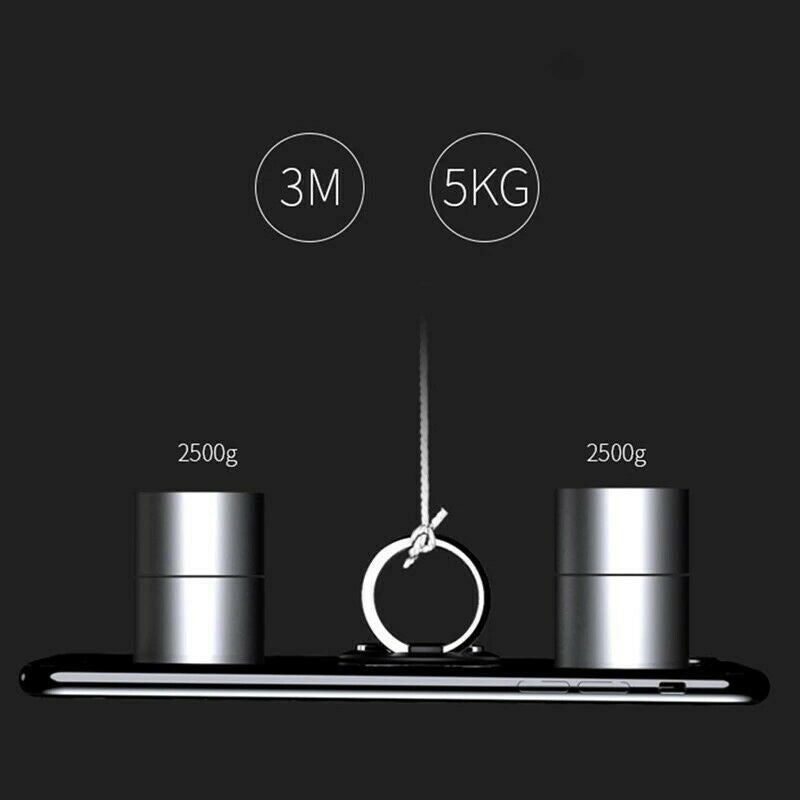 A black circular adhesive mounting hook on a phone, supporting two 2500g weights totaling 5kg, against a dark background.