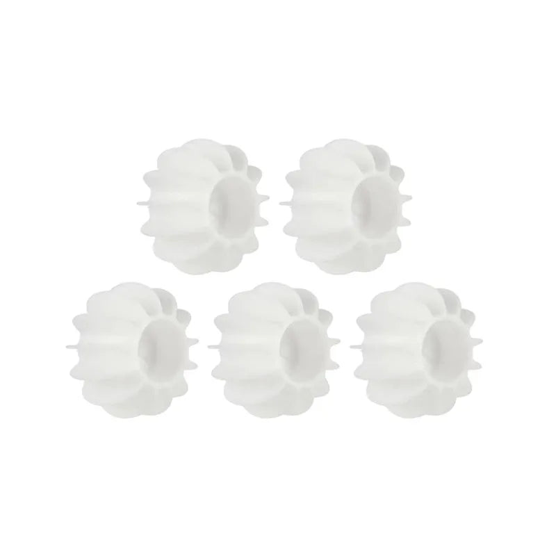 Five white, circular plastic replacement wheels with a ridged, gear-like outer edge.
