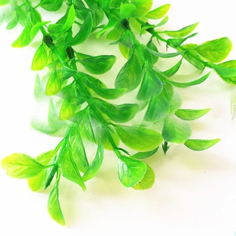 Artificial aquarium plant with vibrant green, oval-shaped plastic leaves on a white background.