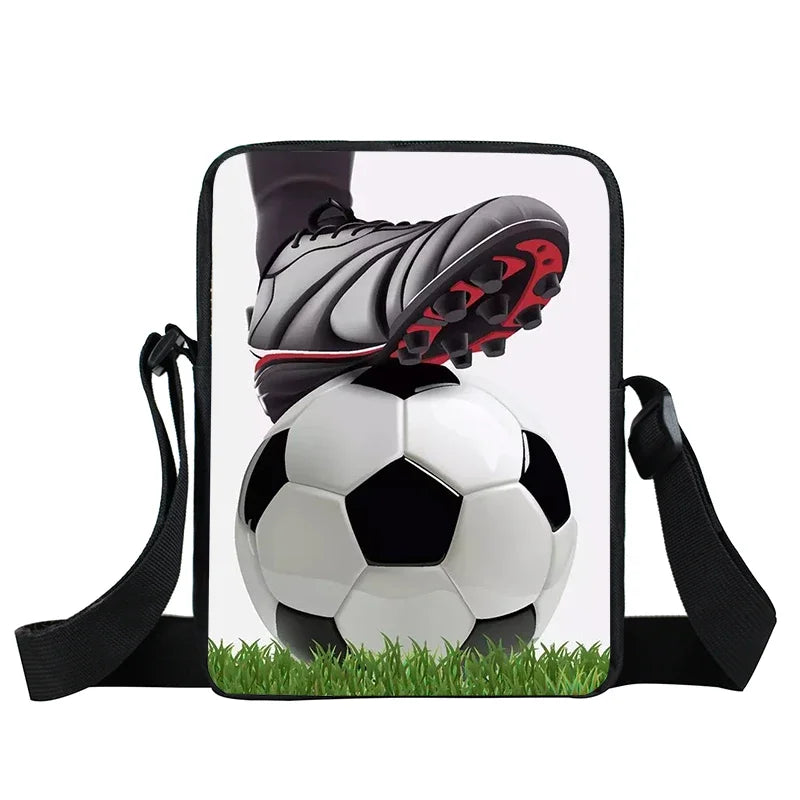 Black crossbody bag featuring a printed graphic of a football boot resting on a classic black and white football.