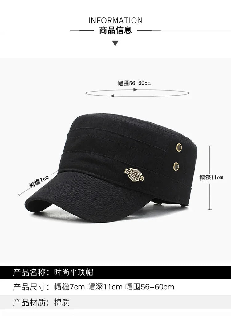 Black cotton military-style flat top cap with side eyelets and a metallic decorative badge on the brim.