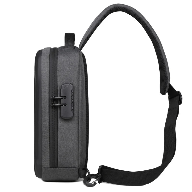 Dark grey anti-theft crossbody bag with a side combination lock, adjustable strap, and sleek, minimalist design.