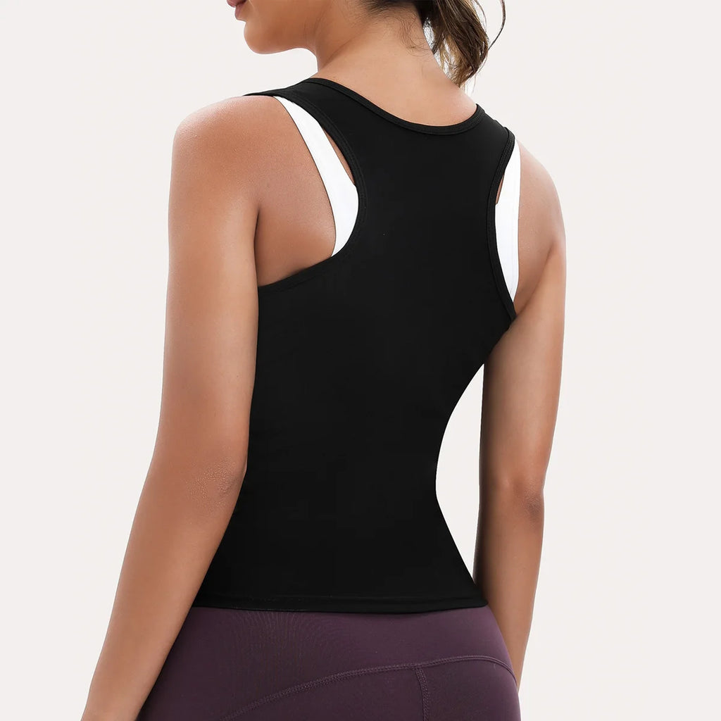 Rear view of a black racerback tank top worn over a white sports bra, featuring a fitted, athletic style.
