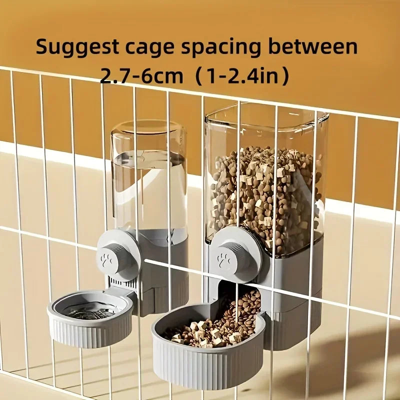 Two grey, wall-mounted pet feeders attached to a wire cage; one clear tank for water, one for food kibble.