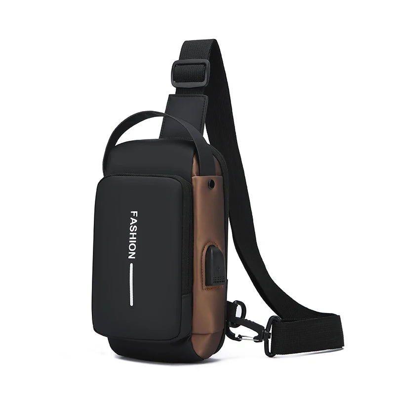 Black and bronze crossbody chest bag with an adjustable strap, top handle, and built-in USB charging port.