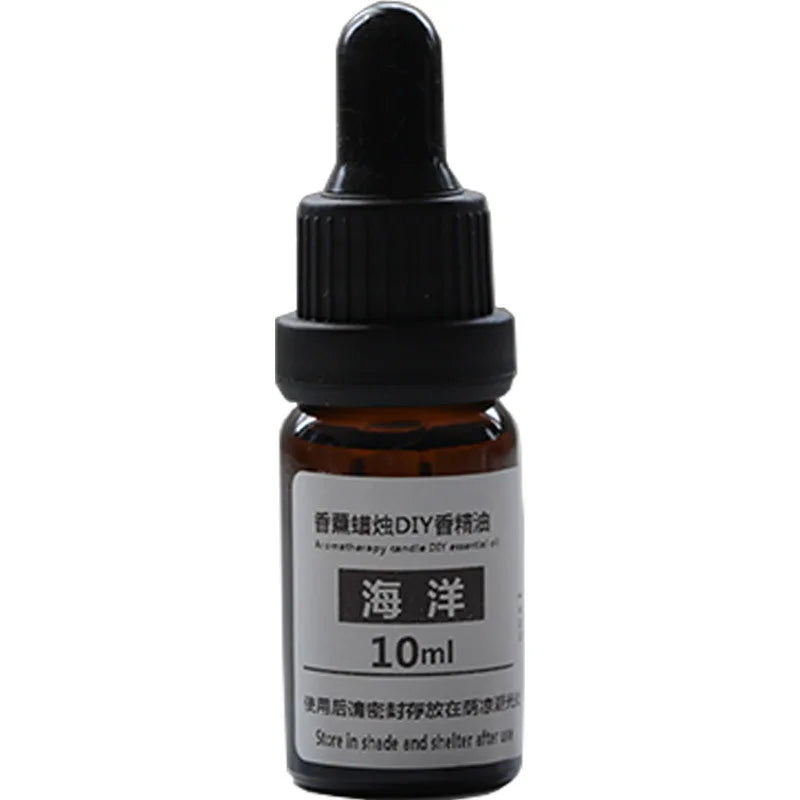 10ml amber glass bottle of DIY candle aromatherapy essential oil with a black dropper cap.