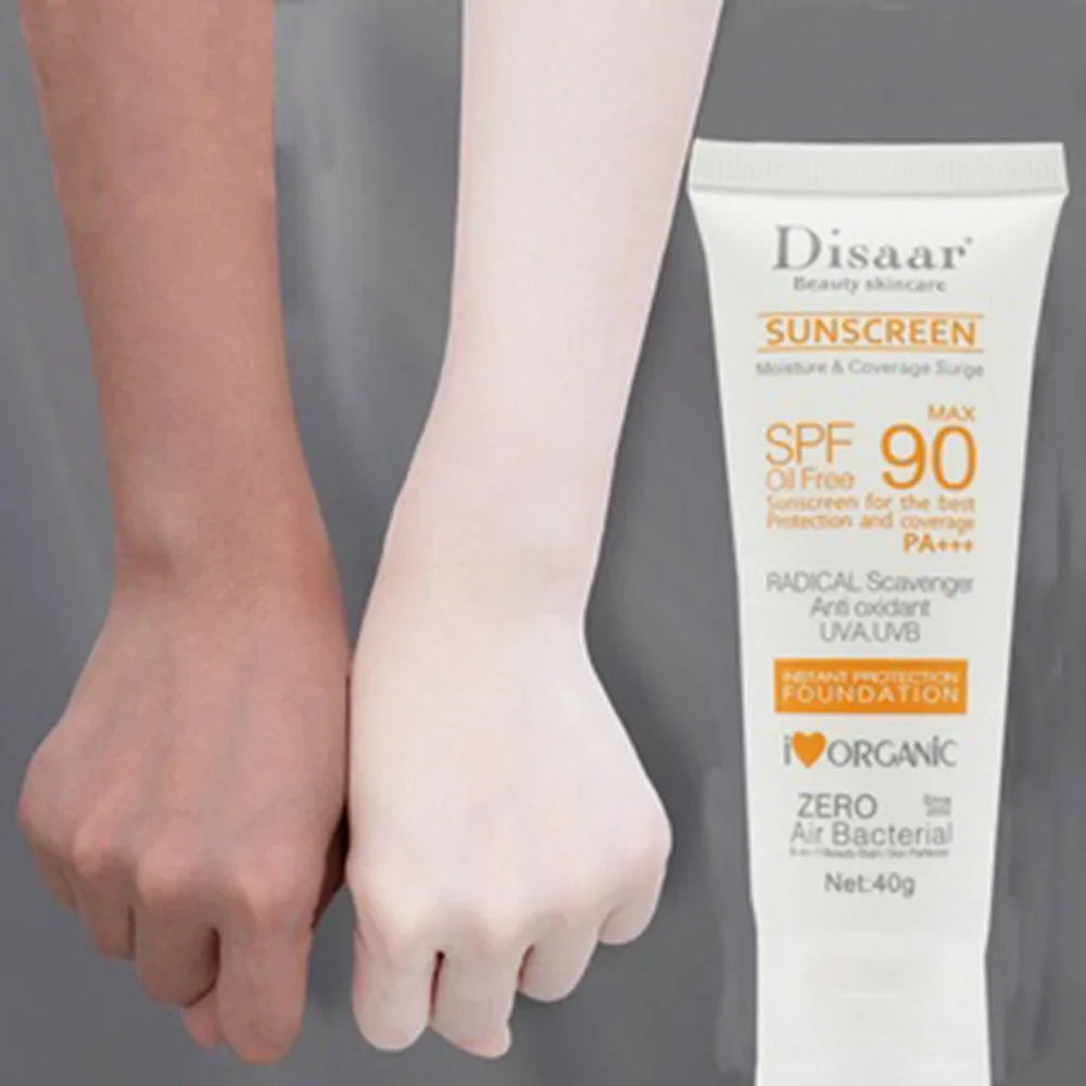 A 40g tube of SPF 90 oil-free sunscreen and foundation next to two arms showing a brightening skin effect.