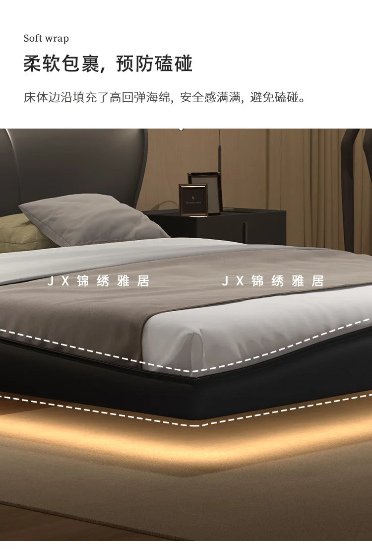 Modern black upholstered bed frame with a soft, padded edge and integrated warm under-bed lighting.