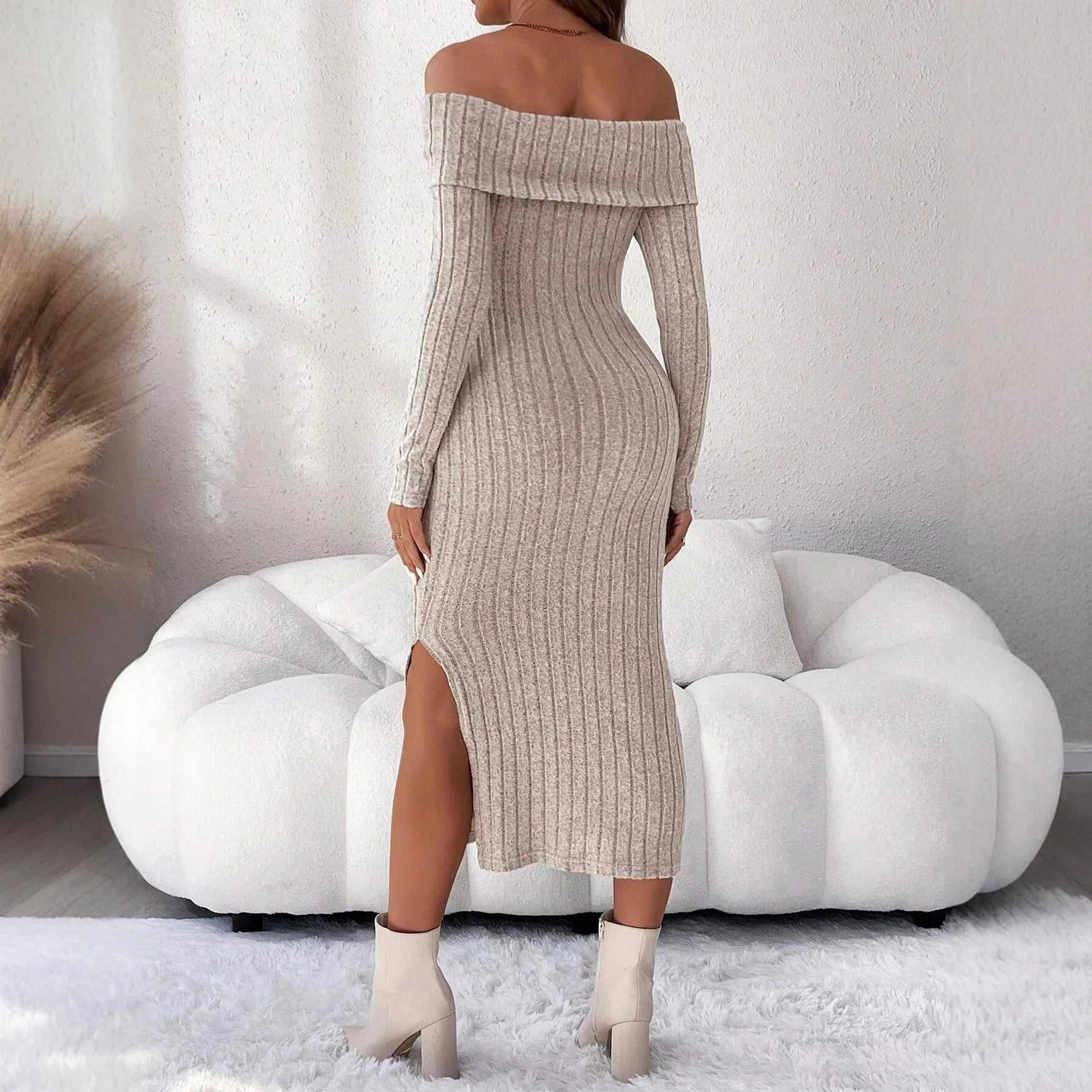 Beige ribbed off-the-shoulder midi sweater dress with long sleeves and a side leg slit.