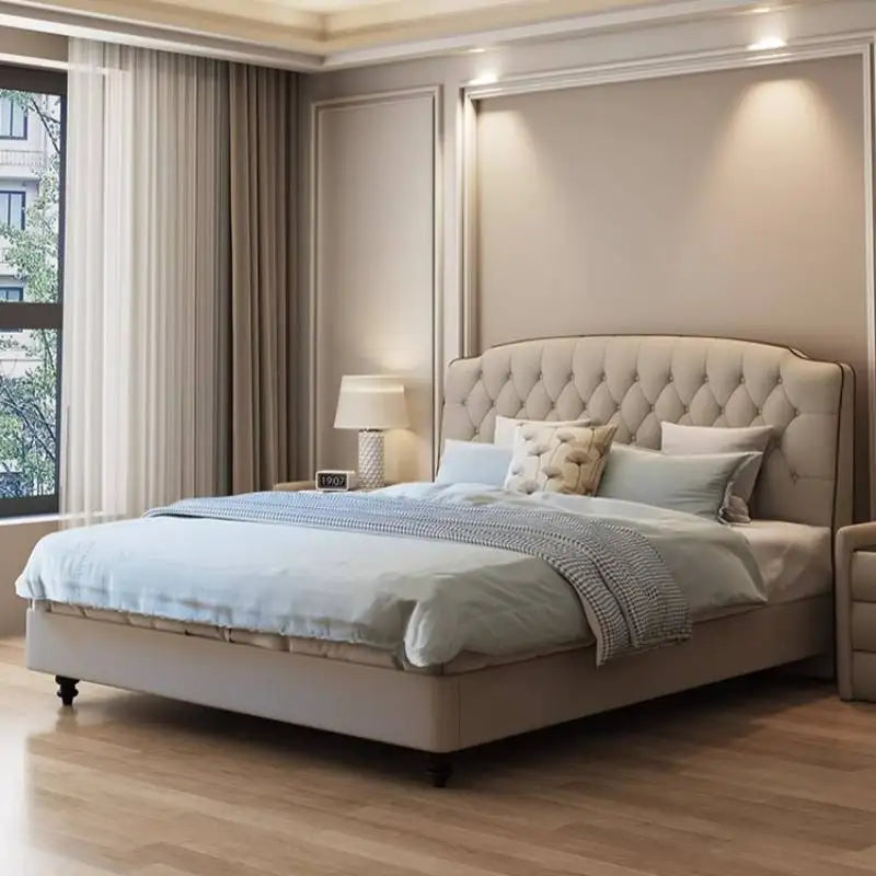 Modern cream upholstered queen bed frame with a tufted, arched headboard in a contemporary bedroom setting.