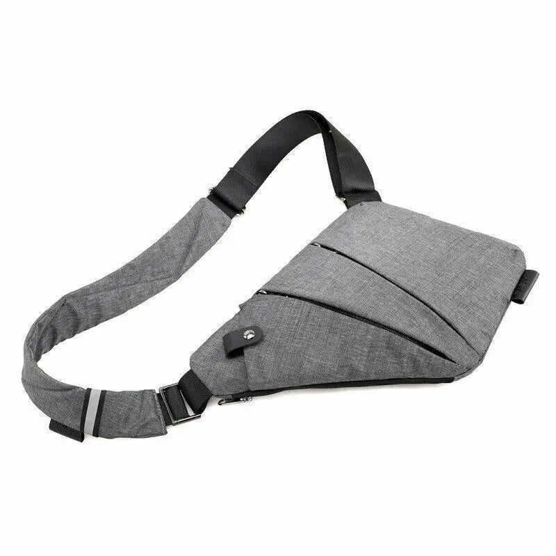 Grey slimline waterproof crossbody chest bag with an adjustable strap, multiple zip pockets, and reflective detail.