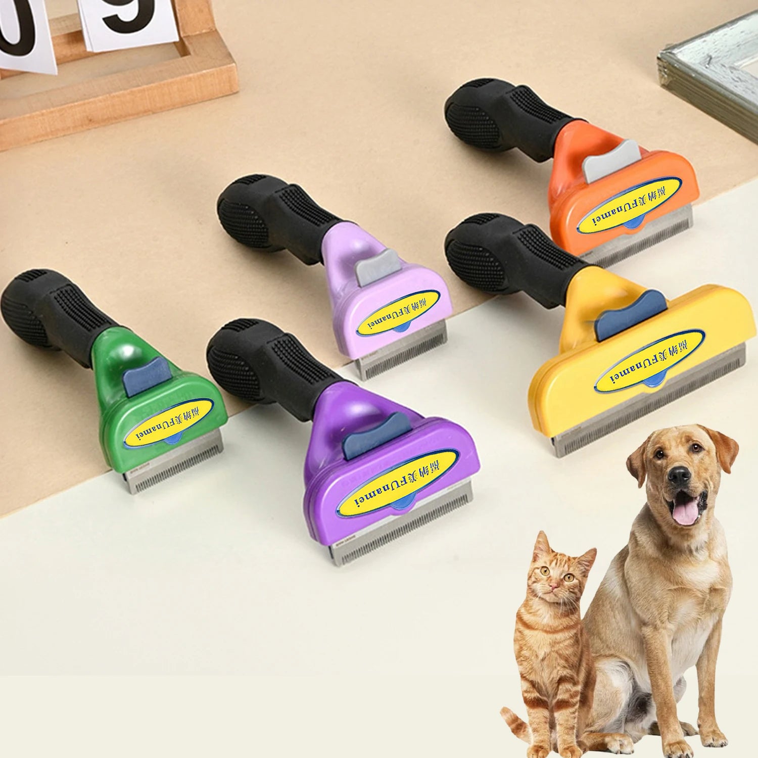 Five pet deshedding brushes in green, purple, and yellow, each with a black grip, placed beside a dog and cat.