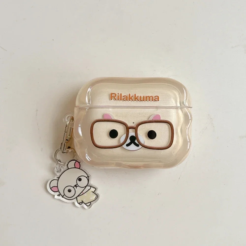 Clear, beige Rilakkuma-themed silicone AirPods Pro case with matching character keyring.