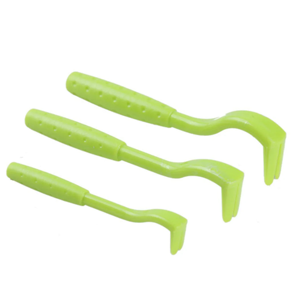 Three lime green plastic tick removal tools of varying sizes, each with a textured handle and split hook end.