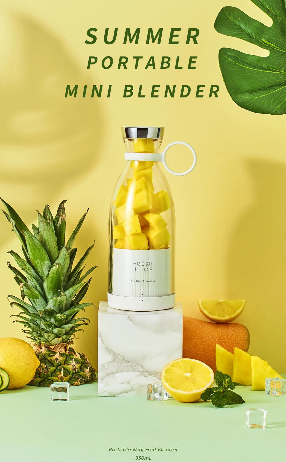 A white portable mini blender containing chopped pineapple, set against a yellow background with fresh fruit.