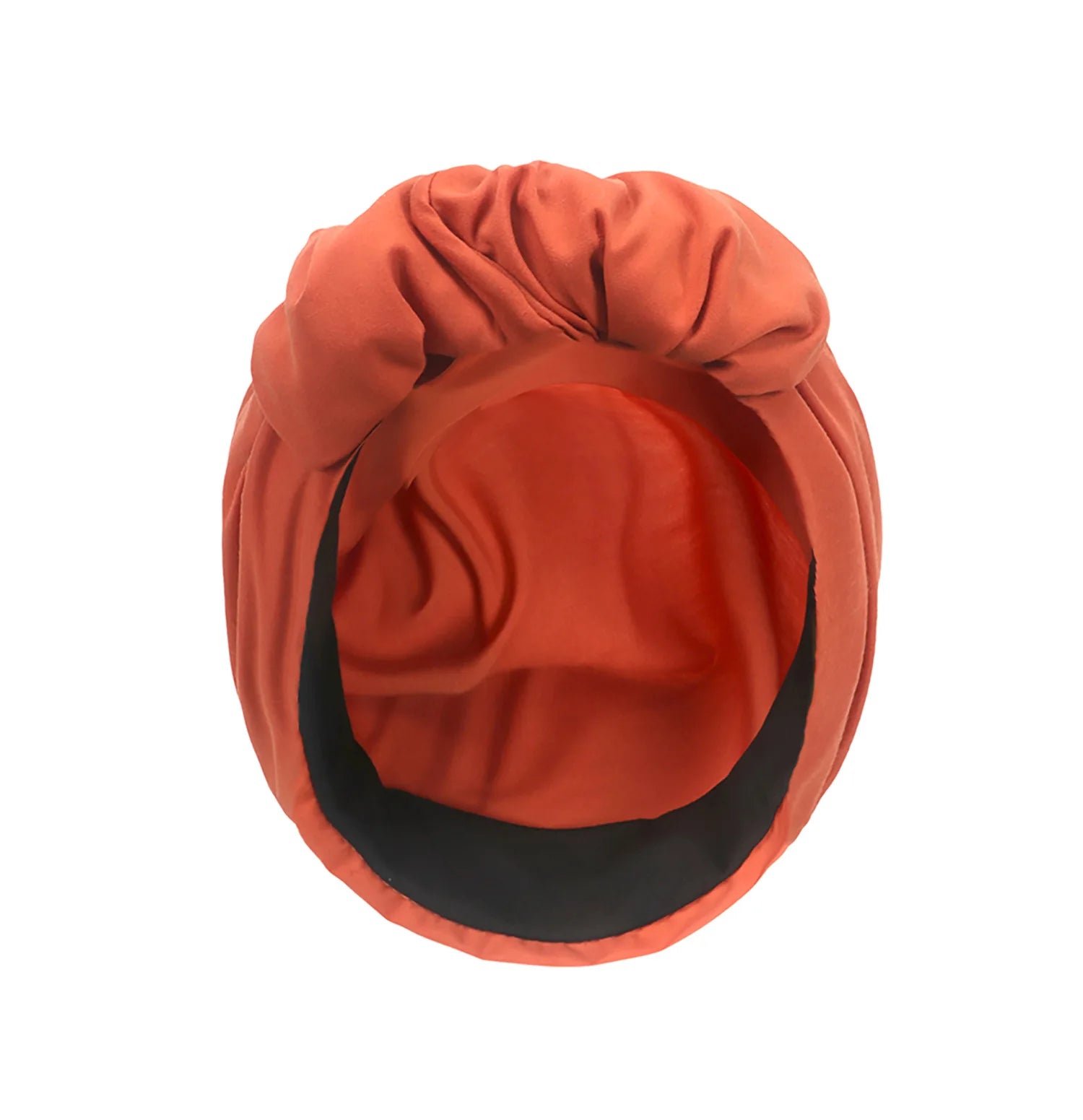 Rust-orange vintage style turban hat with a knotted front and black inner lining, seen from above.