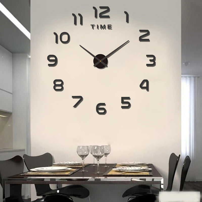 Large black acrylic DIY wall clock with modern numerals and central hands, mounted on a cream dining room wall.