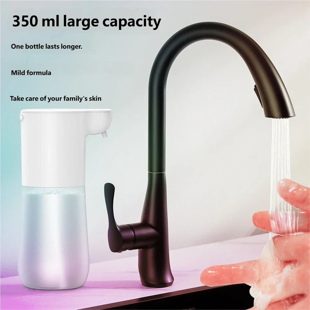 White 350ml automatic touchless foam soap dispenser next to a black kitchen tap with hands being washed.