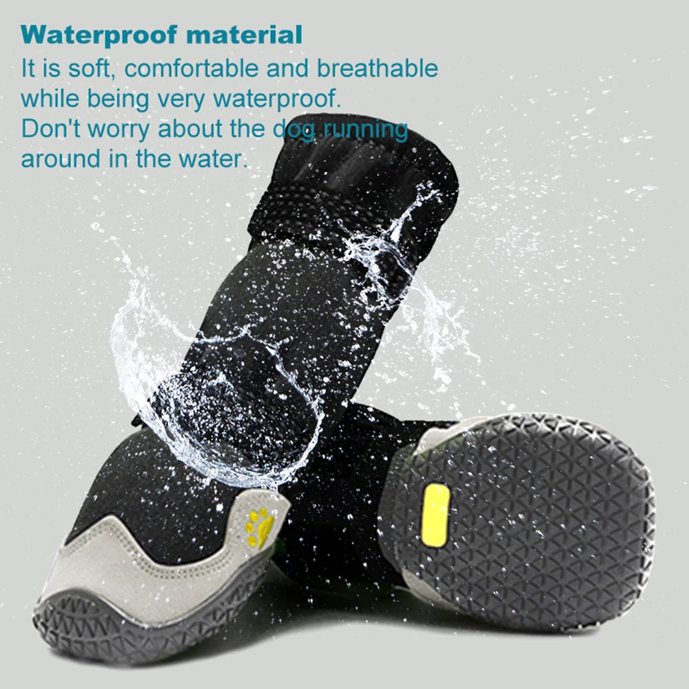Pair of black, waterproof dog boots featuring non-slip textured soles, grey reinforced toes, and adjustable straps.