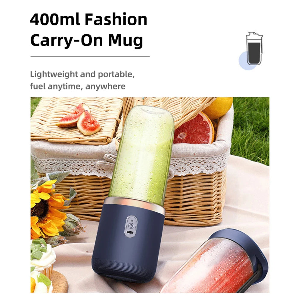 Portable 400ml navy and clear electric blender mug with a power button, set against a picnic basket background.
