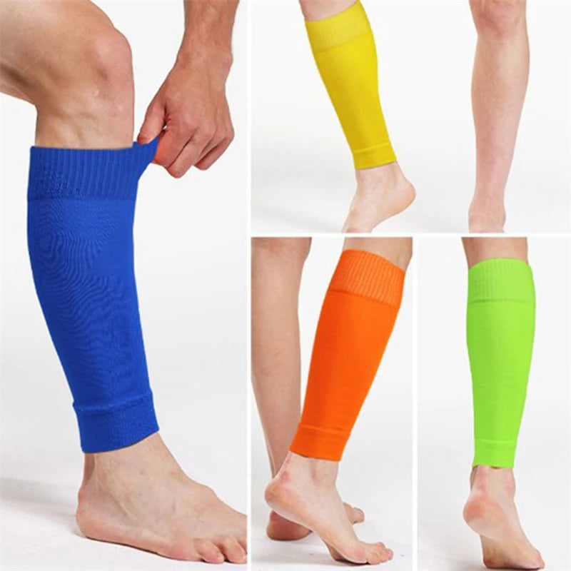 Four people wearing calf-length, breathable compression leg sleeves in blue, yellow, orange, and lime green.