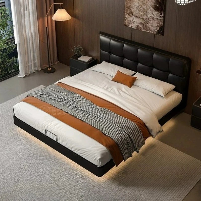 Luxury black leather floating double bed with a tufted headboard and integrated under-bed lighting.