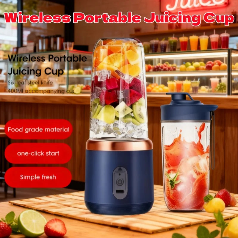 Portable navy blue wireless blender with a rose gold base, containing sliced fruits, next to a matching travel cup.