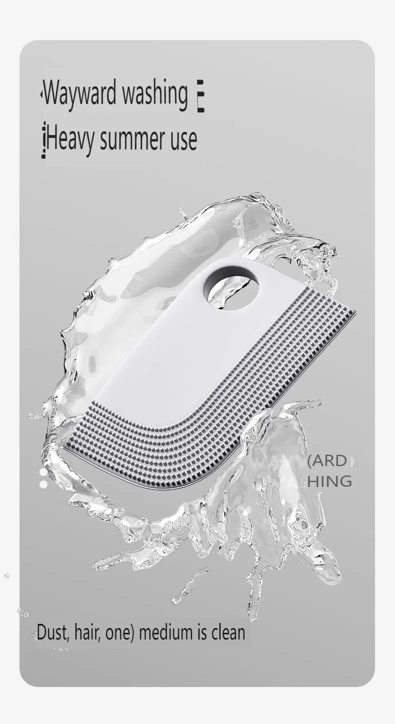 White, semi-circular cleaning brush with textured rubber bristles, shown splashing in water against a grey background.