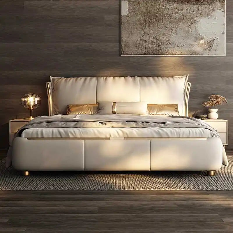 Modern beige double bed frame with a plush, upholstered headboard and gold metal detailing in a sleek, minimalist room.