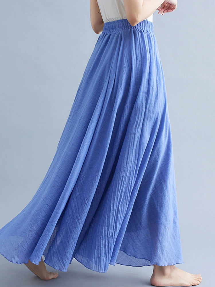 Blue maxi skirt with a comfortable elasticated waistband and flowing, pleated fabric.
