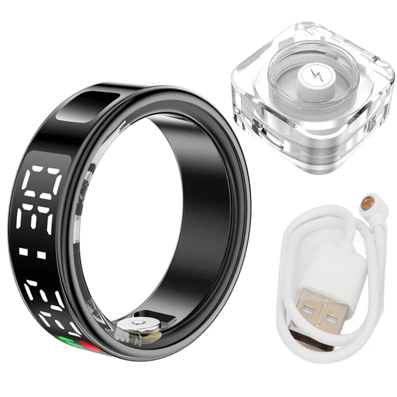 Sleek black smart health ring with digital display, charging dock and USB cable for heart rate and sleep tracking.