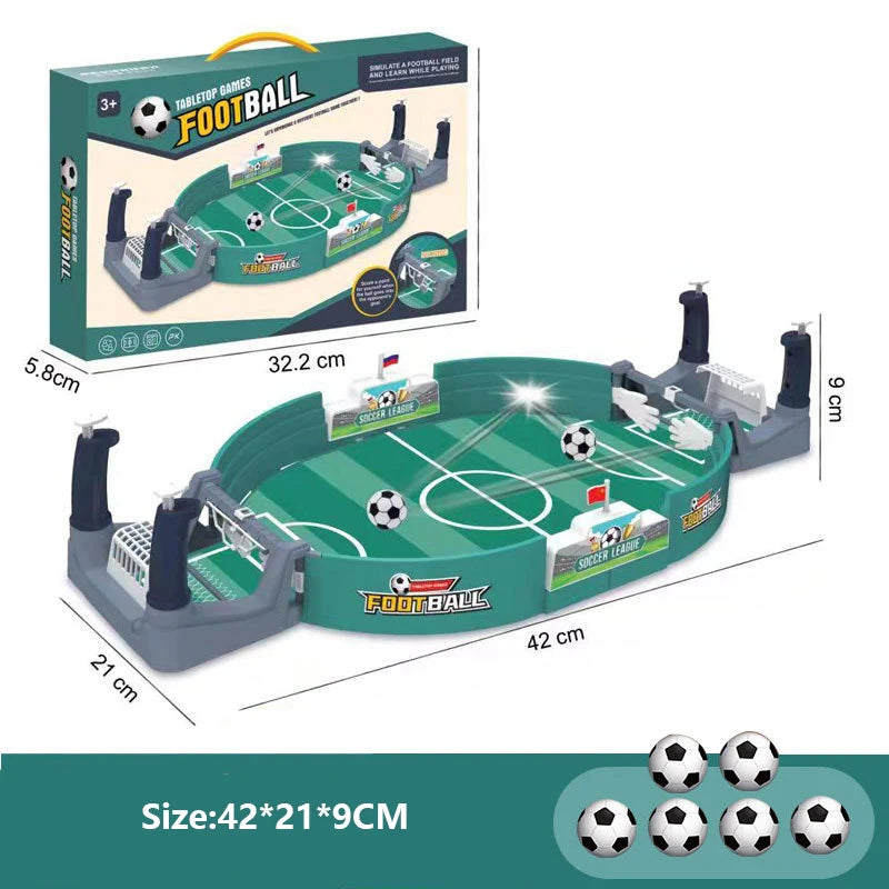 Tabletop football game set with green pitch, two manual player controls, goals, and six mini footballs.