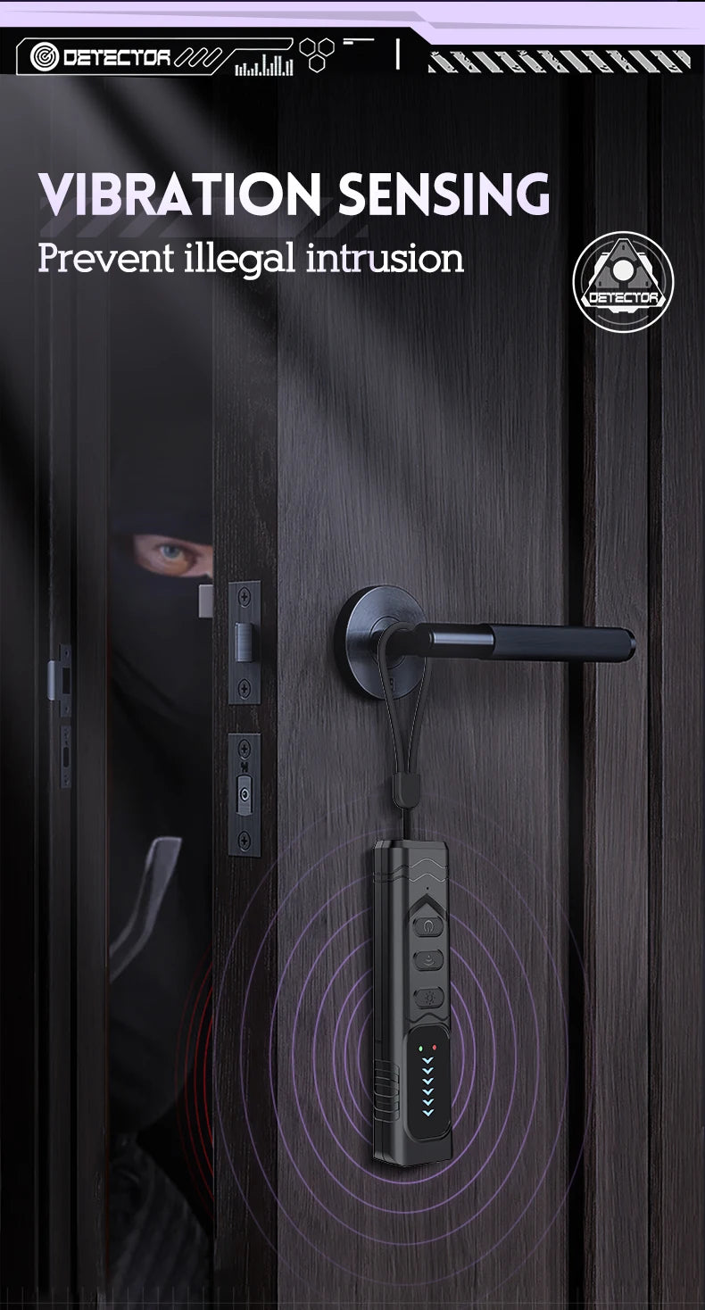 Black, portable vibration-sensing privacy detector hanging from a door handle to alert against intrusion.