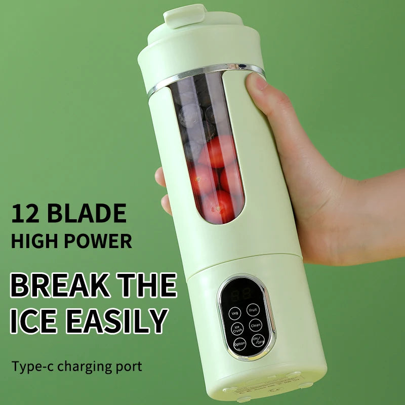 A hand holds a portable, light green personal blender with a transparent fruit chamber and a digital control panel.