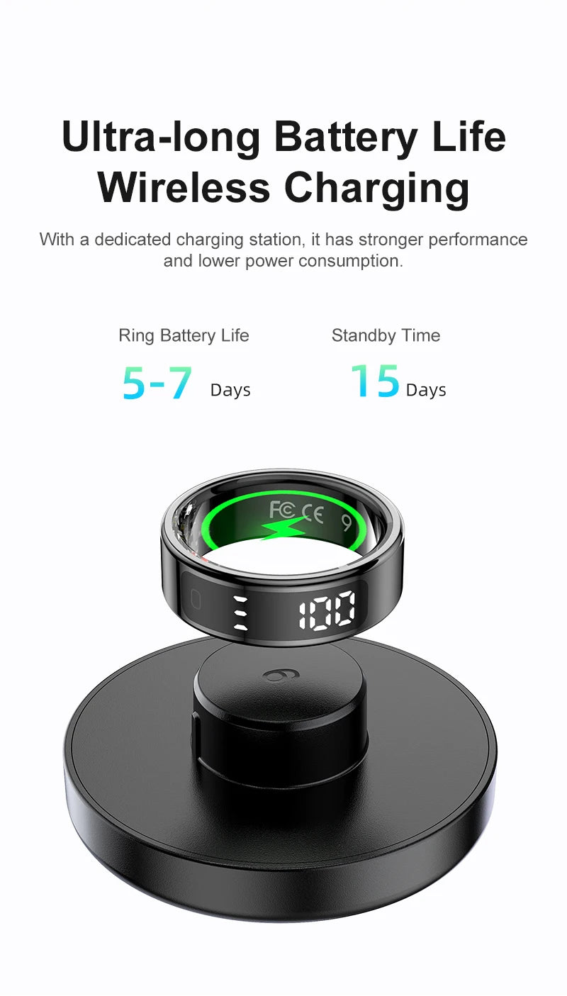 Black smart fitness ring with digital display, shown charging wirelessly on a circular black base.