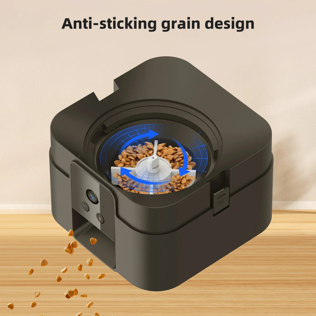 Black automatic pet feeder with an anti-stick internal rotating mechanism dispensing dry kibble.