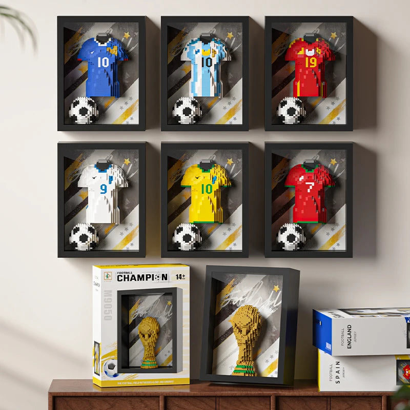 Six framed 3D brick art displays of football jerseys and balls, plus two framed golden trophy brick art kits.