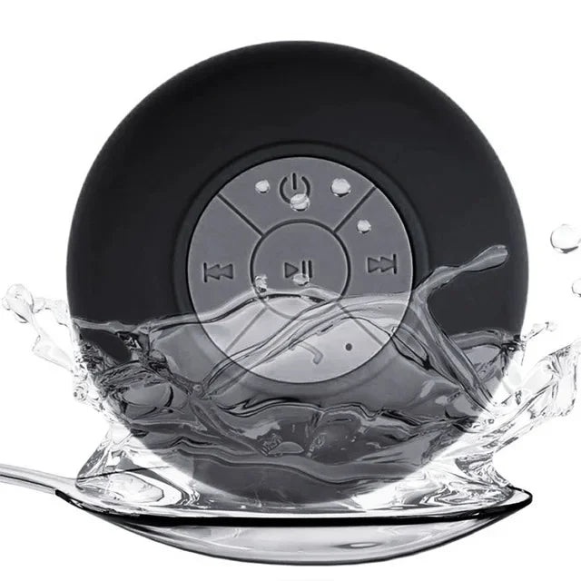 Black circular waterproof Bluetooth speaker with central control buttons, shown splashing in water.